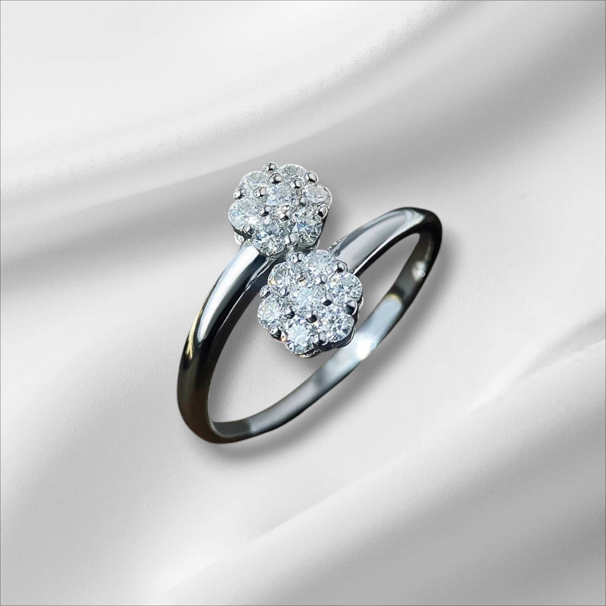 Bee-Bee's sterling silver ring with two floral clusters of round moissanite stones, D VVS1 certified.