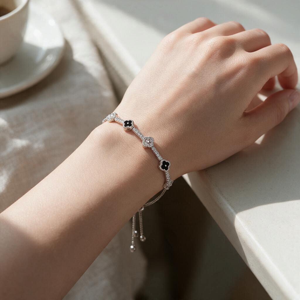 Bee-Bees flower tennis bracelet in 925 sterling silver with moissanite stones worn on a woman's wrist.