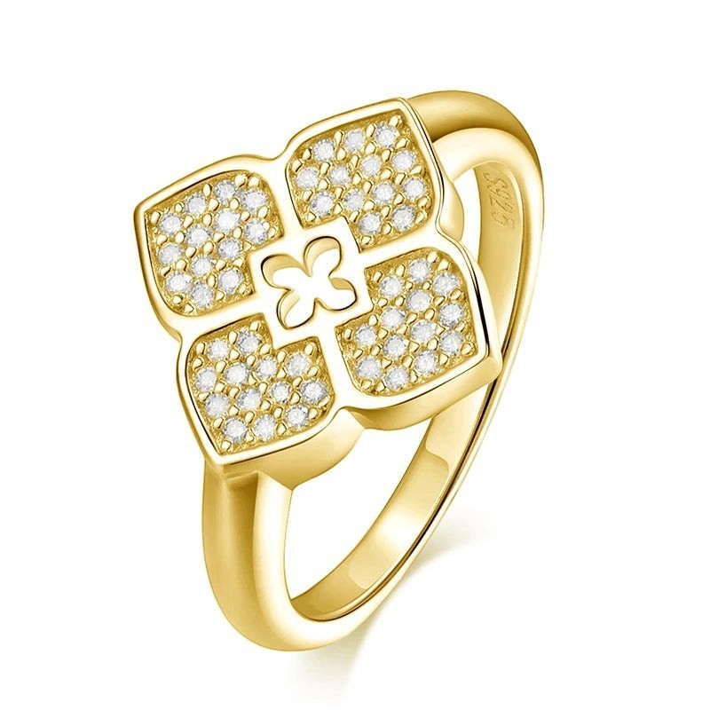 Bee-Bees yellow gold plated sterling silver ring with four-leaf clover design and sparkling moissanite stones.