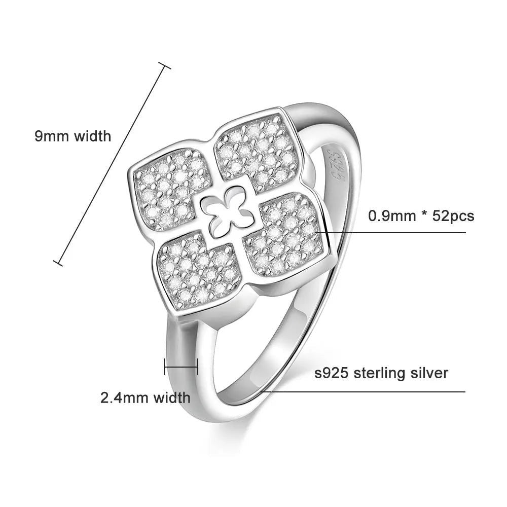 Bee-Bees silver four-leaf clover ring with pave moissanite stones, 9mm width, GRA certified.