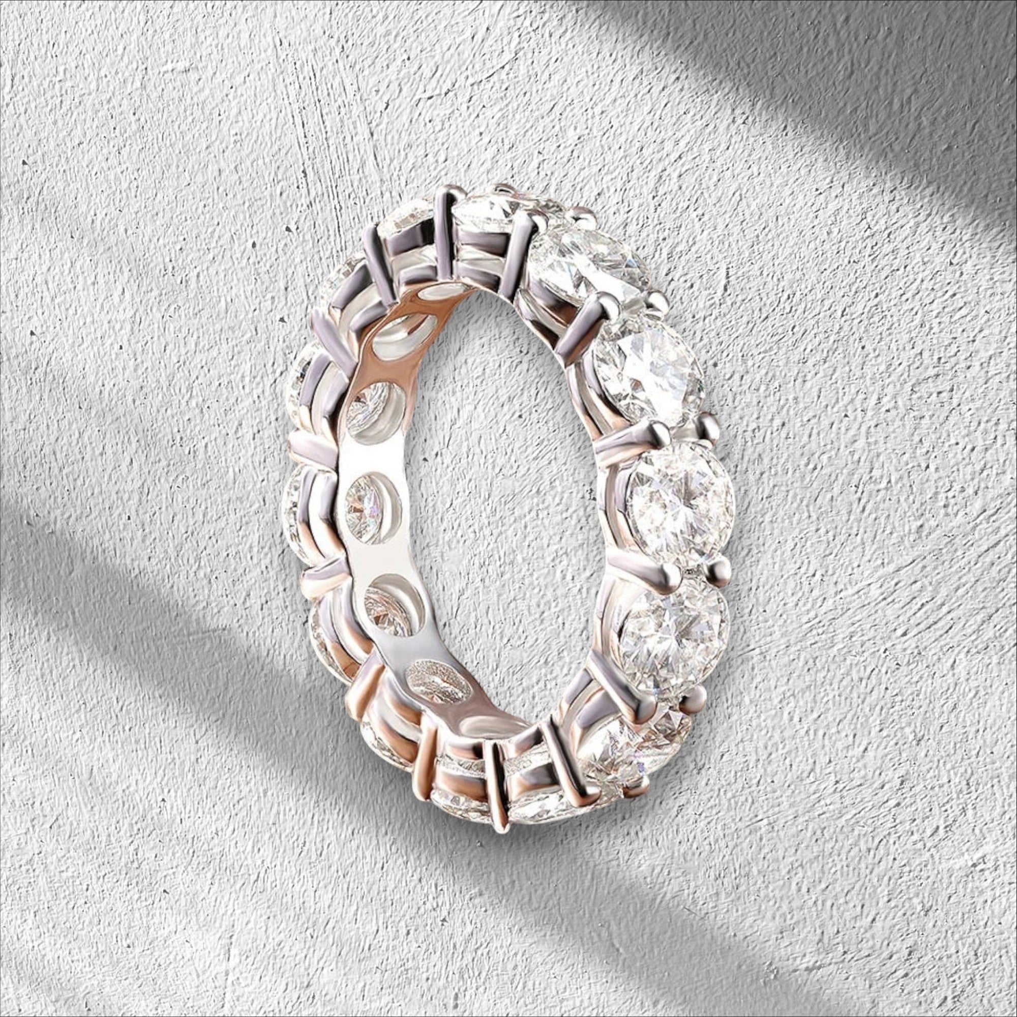 Bee-Bees full eternity band with 7.0 CTW round moissanite stones in 925 sterling silver with 18K white gold plating.