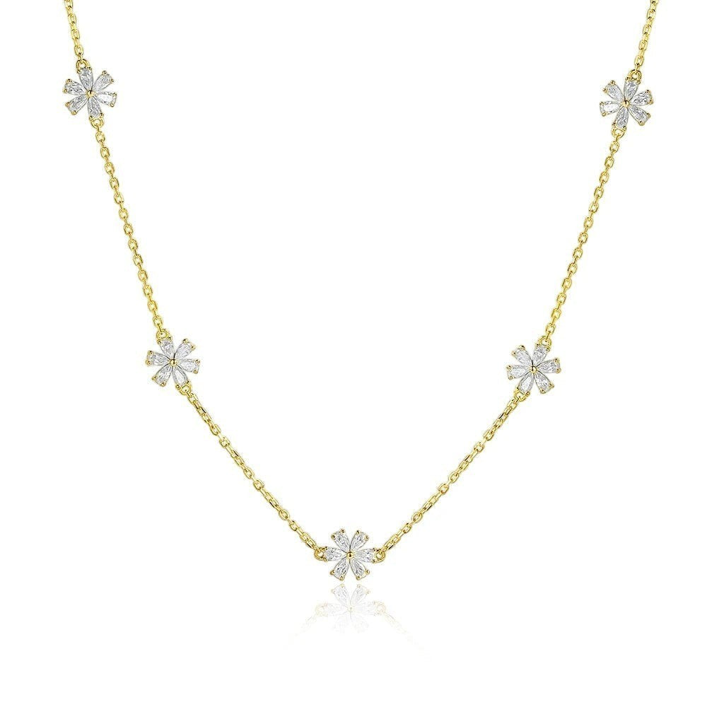 Bee-Bee's dainty gold chain necklace with five small flower charms, each with clear cubic zirconia stones.
