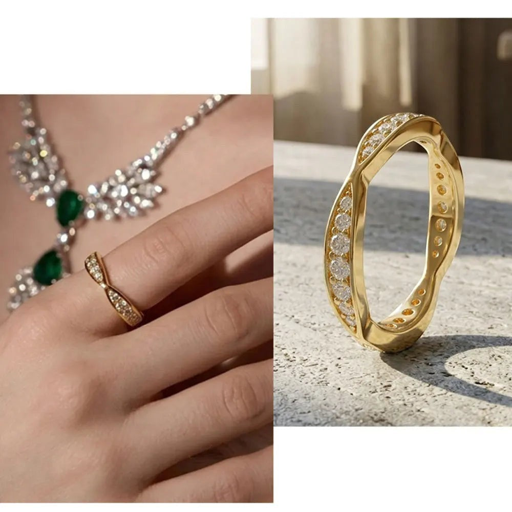 Bee-Bees gold-plated sterling silver moissanite eternity band with a twisted design worn on a finger