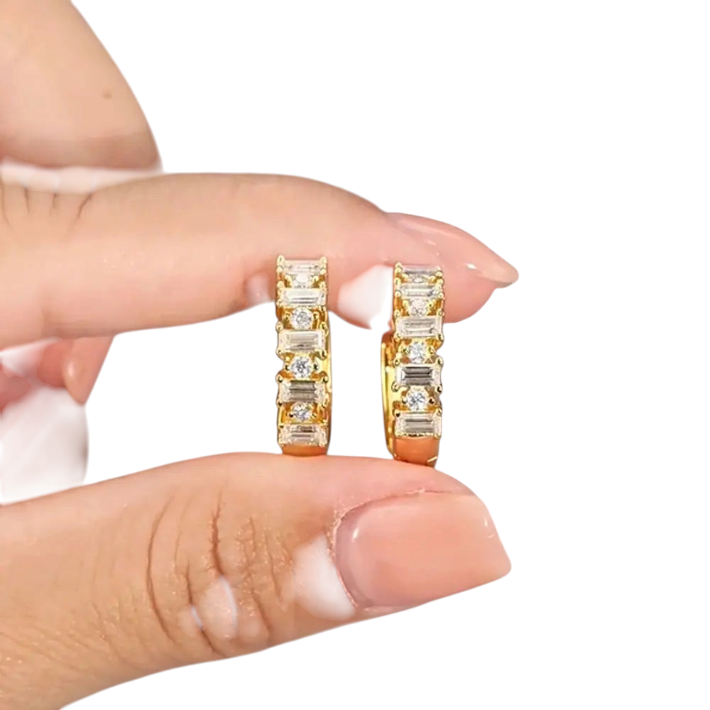 Bee-Bees 18K gold plated sterling silver huggie earrings featuring emerald and round cut moissanite stones.