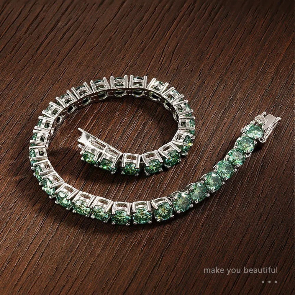 Bee-Bee's green moissanite tennis bracelet with 18K gold plated sterling silver, D color, VVS1 clarity, and secure clasp.