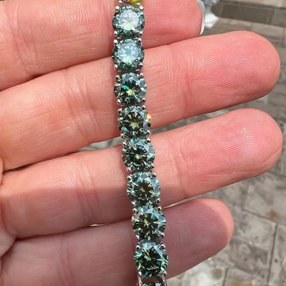 Bee-Bee's green moissanite tennis bracelet with 8 heart & 8 arrow cut stones on s925 sterling silver with 18K gold plating.