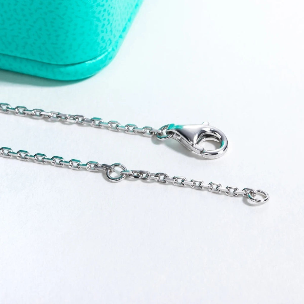 Bee-Bees 1ct heart moissanite bracelet in sterling silver with 18k gold plating and adjustable chain.