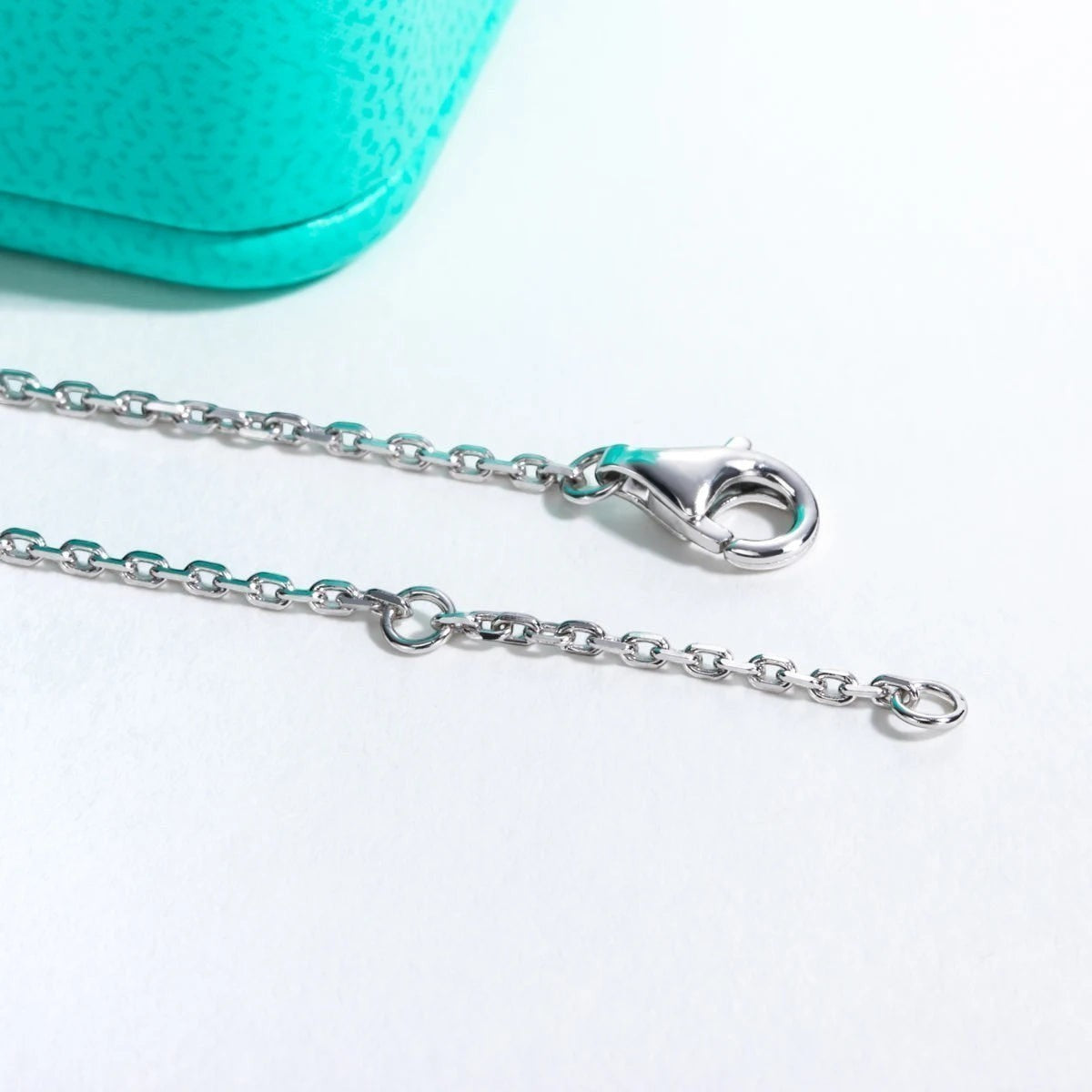 Bee-Bees 1ct heart moissanite bracelet in sterling silver with 18k gold plating and adjustable chain.
