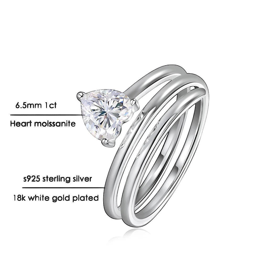 Bee-Bees 1ct heart cut moissanite spiral eternity ring in sterling silver with 18k white gold plating.