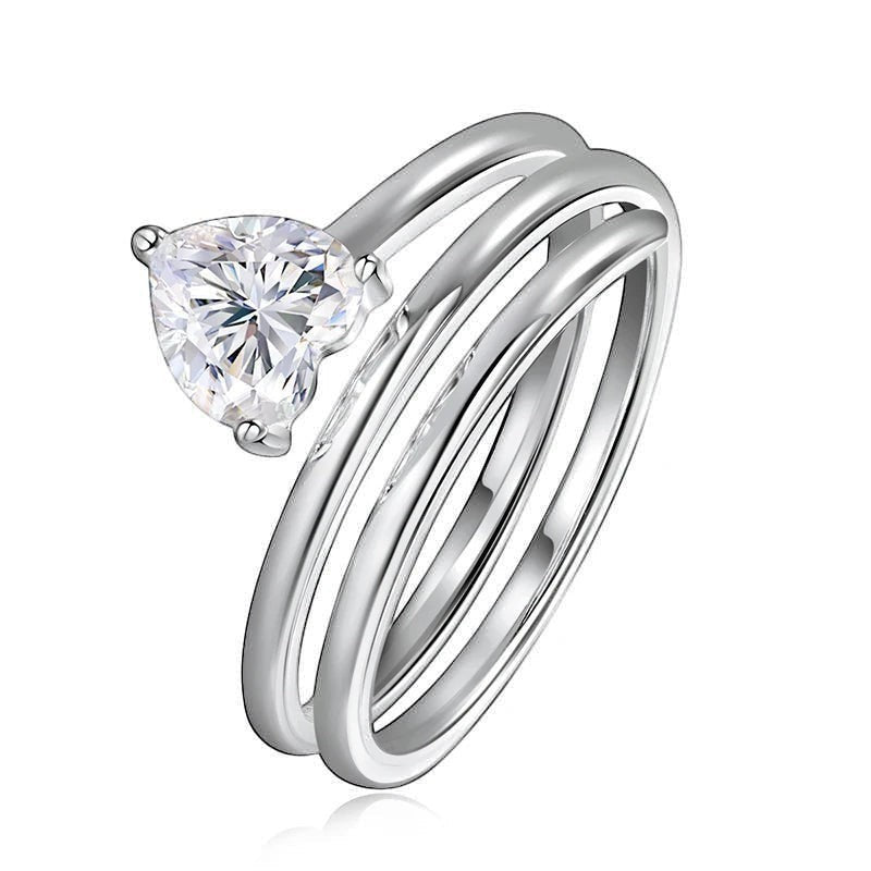 Bee-Bees 1ct heart cut moissanite spiral eternity ring in sterling silver with a twisted band design.