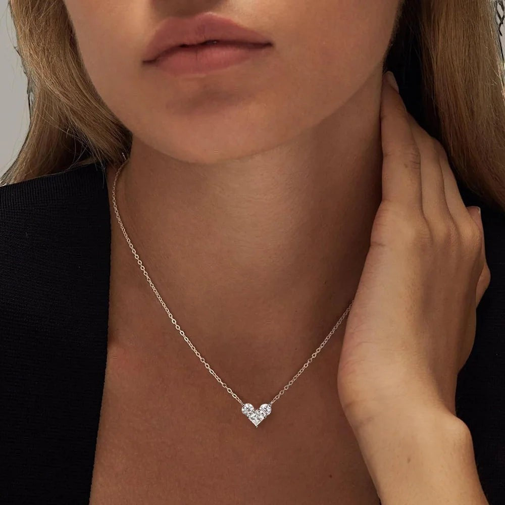 Bee-Bees sterling silver necklace with a heart-shaped pendant made of clear moissanite stones.