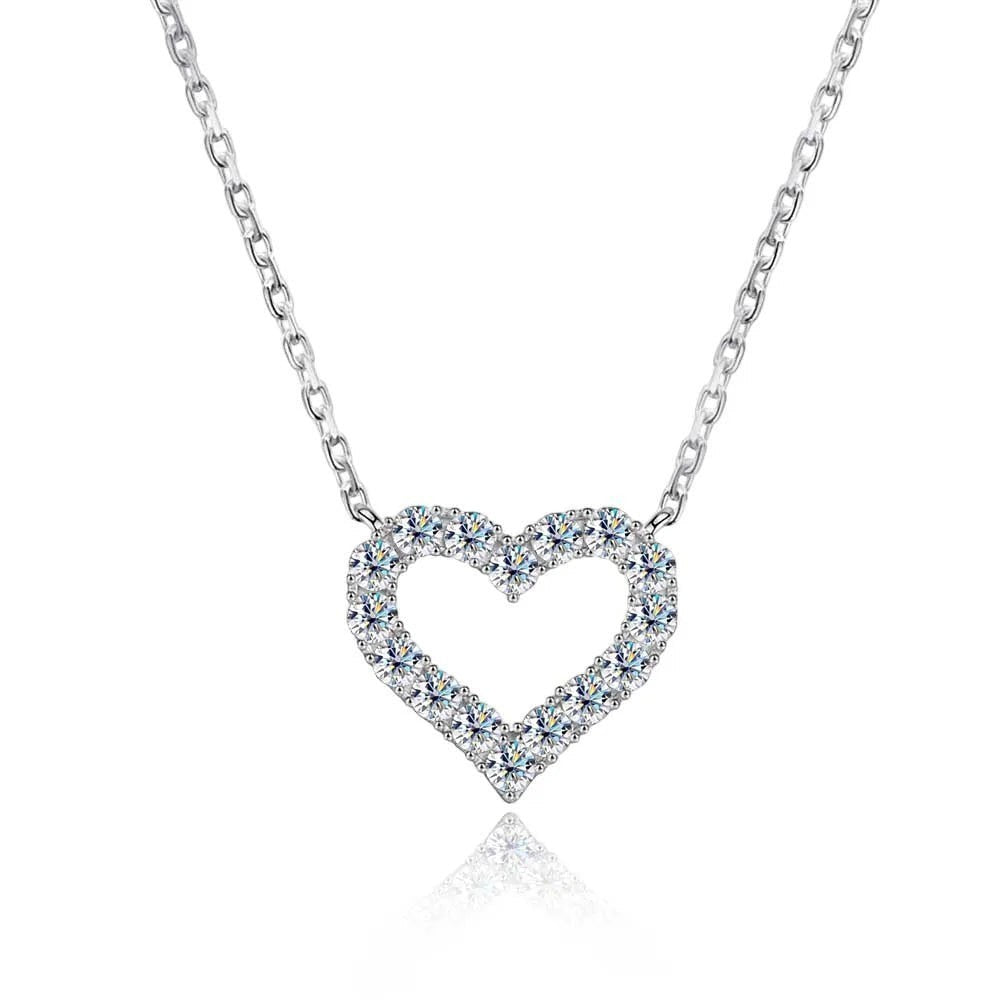 Bee-Bees sterling silver necklace with a heart-shaped pendant encrusted with clear, sparkling moissanite stones.