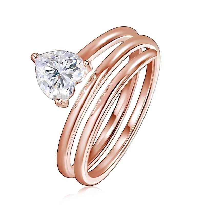 Bee-Bees rose gold plated sterling silver ring with a 1ct heart-cut moissanite stone in a spiral design.