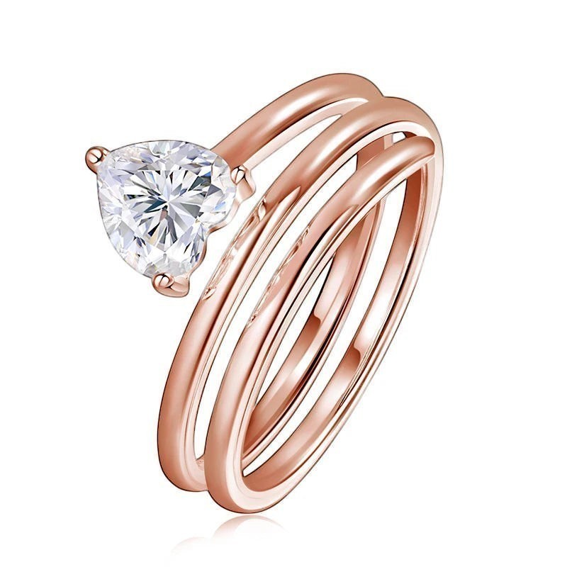 Bee-Bees rose gold plated sterling silver ring with a 1ct heart-cut moissanite stone in a spiral design.