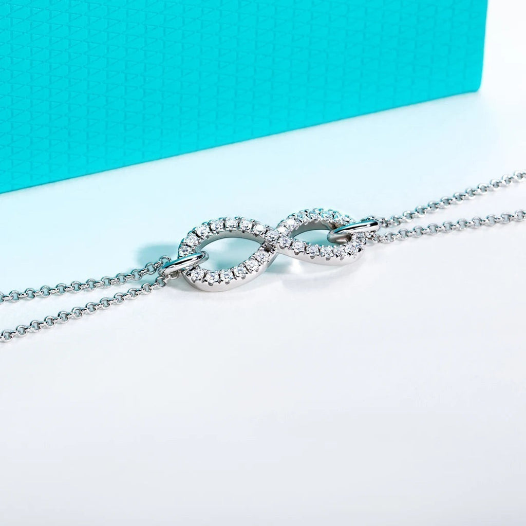 Bee-Bees Sterling silver bracelet with moissanite stones in an infinity symbol design. D VVS1.