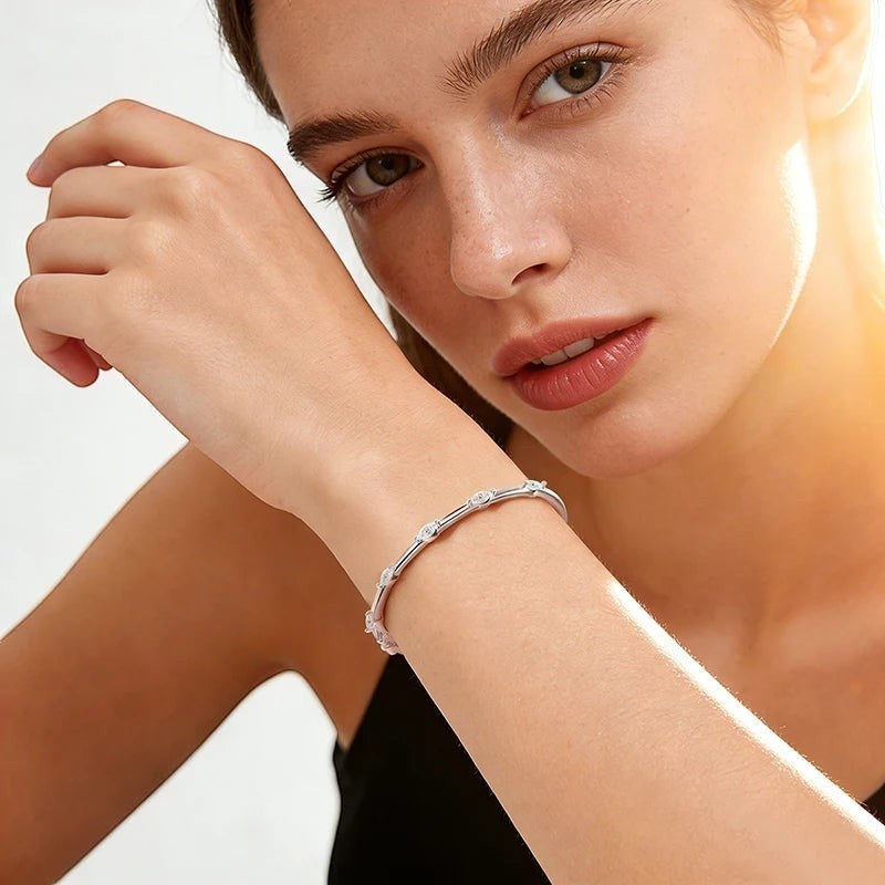 Bee-Bee's 18k white gold plated sterling silver bangle with 5 marquise-cut moissanite stones.