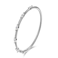 Bee-Bee's 18k white gold plated sterling silver bangle with 5 marquise-cut moissanite stones.