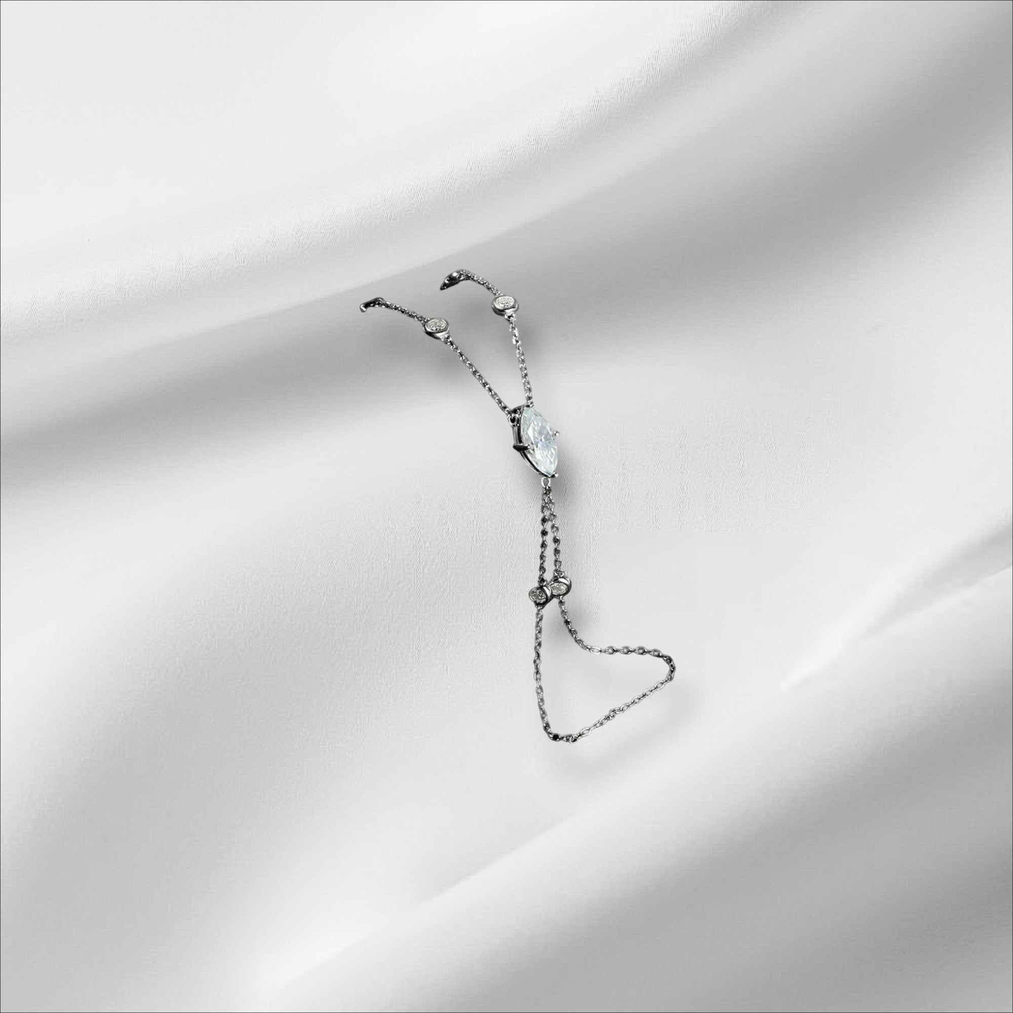 Bee-Bees Marquise cut moissanite finger bracelet in s925 sterling silver with 18k gold plating. Features a 2ct D VVS1 stone and GRA certificate.