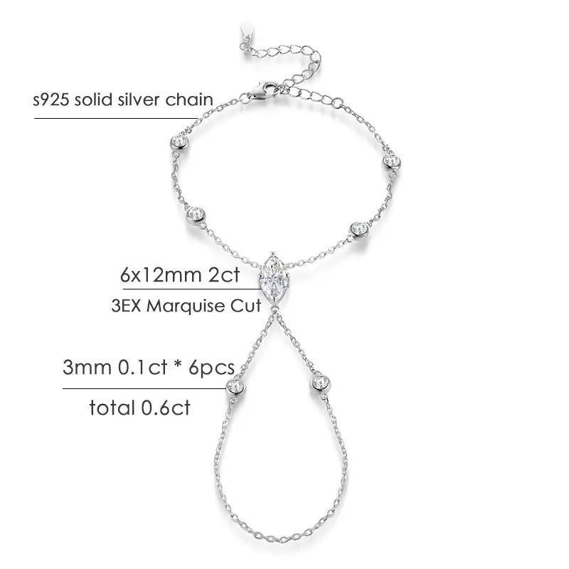 Bee-Bees Marquise cut moissanite finger bracelet in s925 sterling silver with 18k gold plating. Features a 2ct center stone and 6 smaller stones.