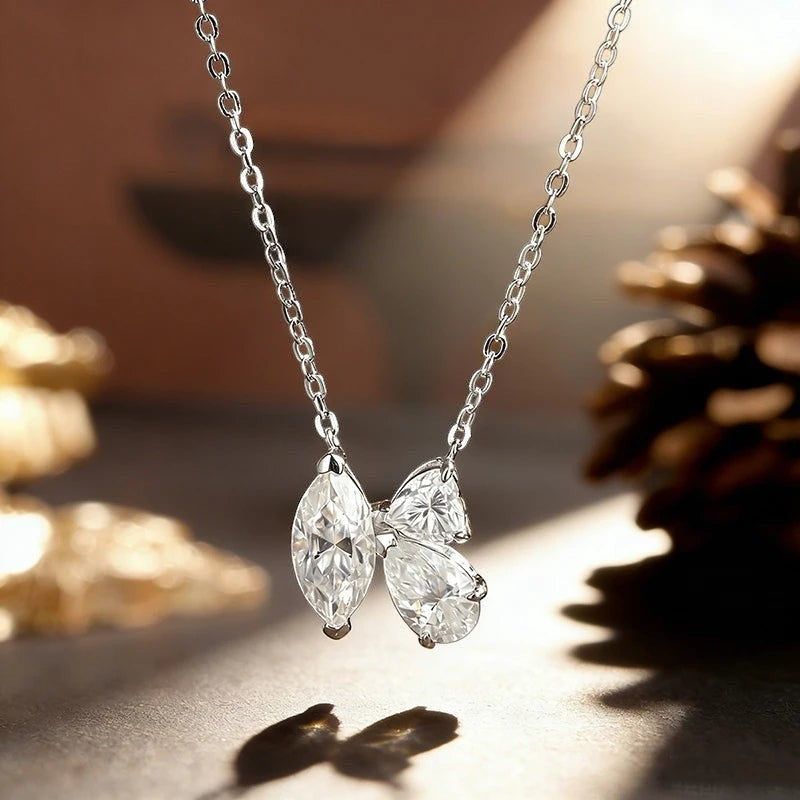 Bee-Bees 1.5ct Marquise Moissanite necklace in sterling silver with D color VVS1 clarity, featuring a bow design.