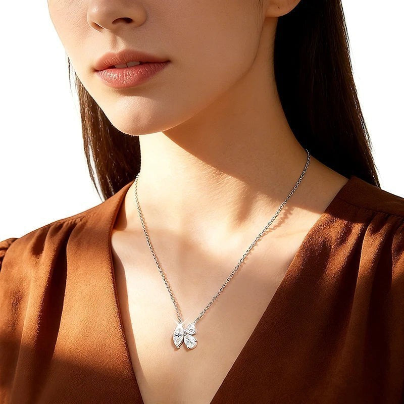 Bee-Bees 1.5ct Marquise cut D Color VVS1 Moissanite pendant necklace in sterling silver with rope chain.