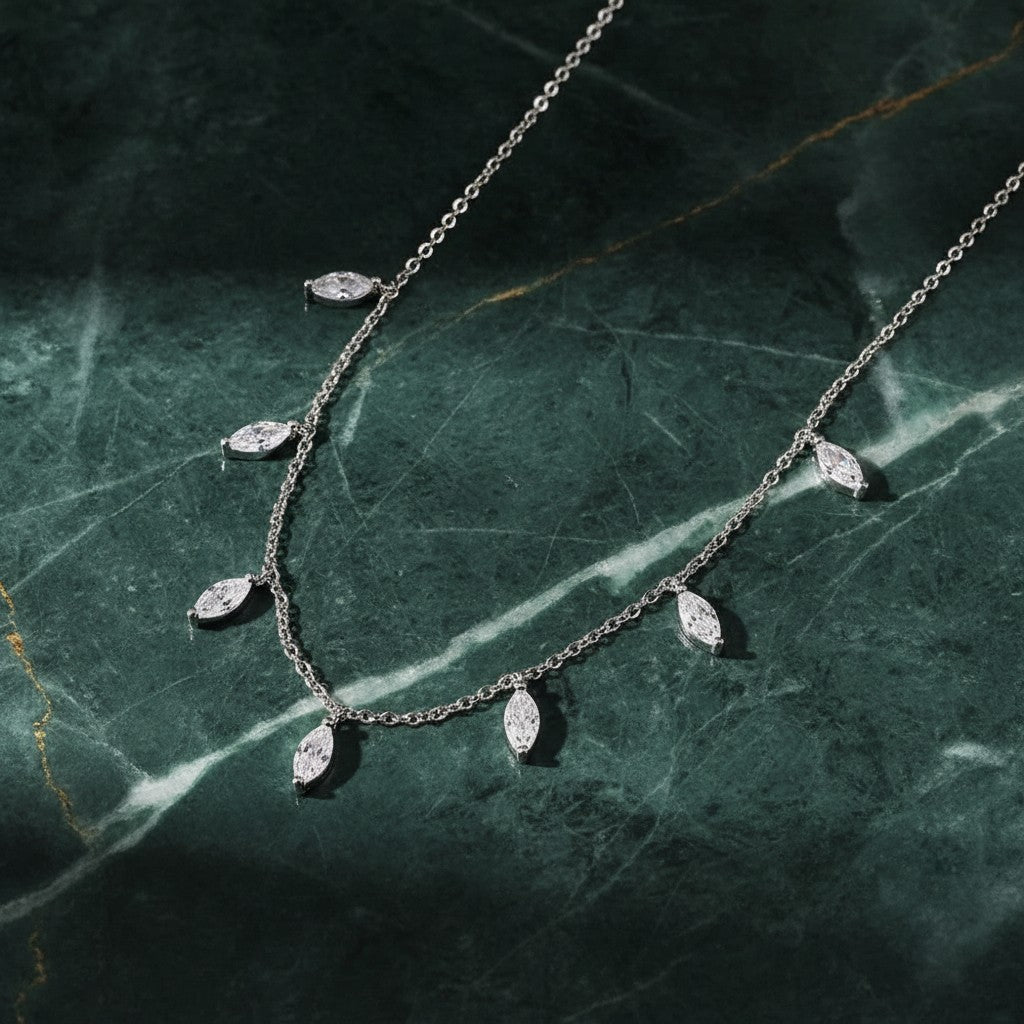Bee-Bees sterling silver necklace with multiple marquise-cut moissanite stones, delicate and elegant.