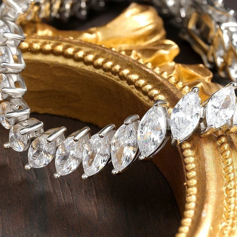 Bee-Bee's 0.5ct marquise cut moissanite tennis bracelet in S925 silver with 18k gold plating. D VVS1 clarity.