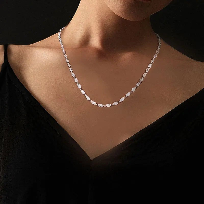 Bee-Bees Marquise moissanite tennis necklace with D color VVS1 stones on sterling silver with 18k gold plating.