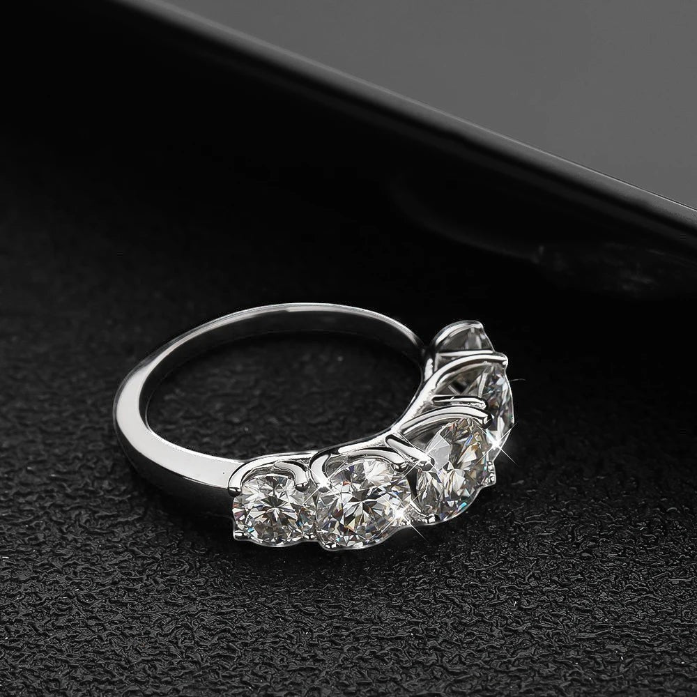Bee-Bees 3.6ctw D Color Moissanite 5-Stone Band in sterling silver with 18k white gold plating. Round brilliant cut stones.