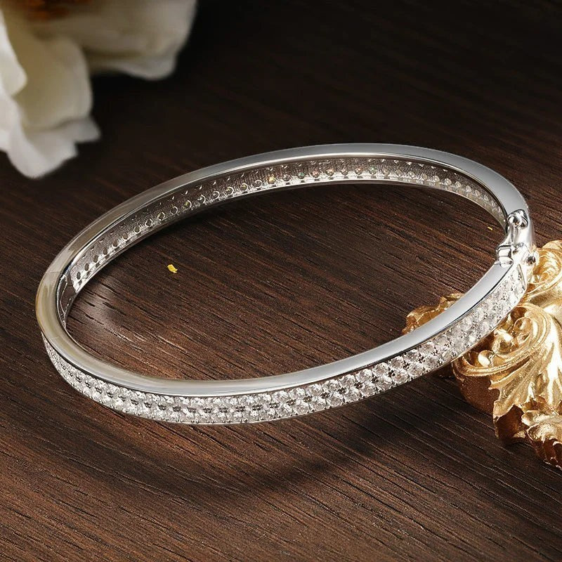 Bee-Bee's sterling silver bangle with 2mm D VVS1 moissanite stones, 18K gold plated, 6mm wide.