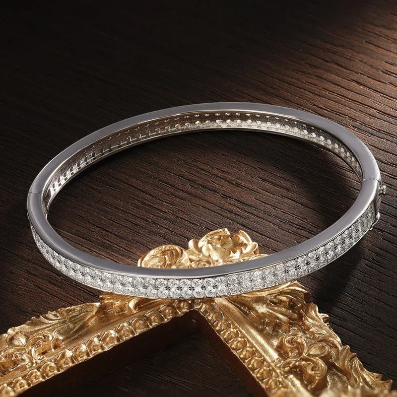Bee-Bees sterling silver bangle with 2mm D VVS1 moissanite stones, 18K gold plated, 6mm wide.