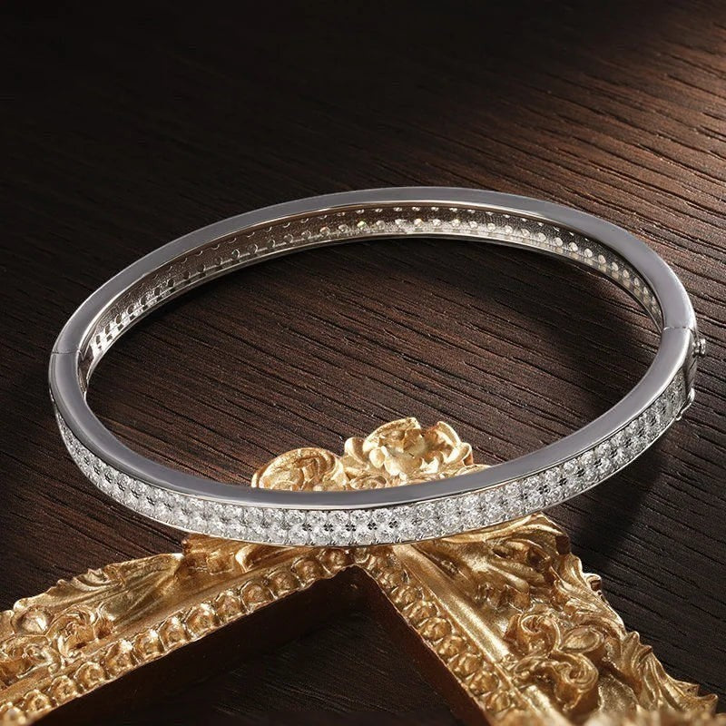 Bee-Bees sterling silver bangle with 2mm D VVS1 moissanite stones, 18K gold plated, 6mm wide.