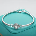 Bee-Bees 1ct Moissanite adjustable bangle in sterling silver with 18k white gold plating and D-color stone.