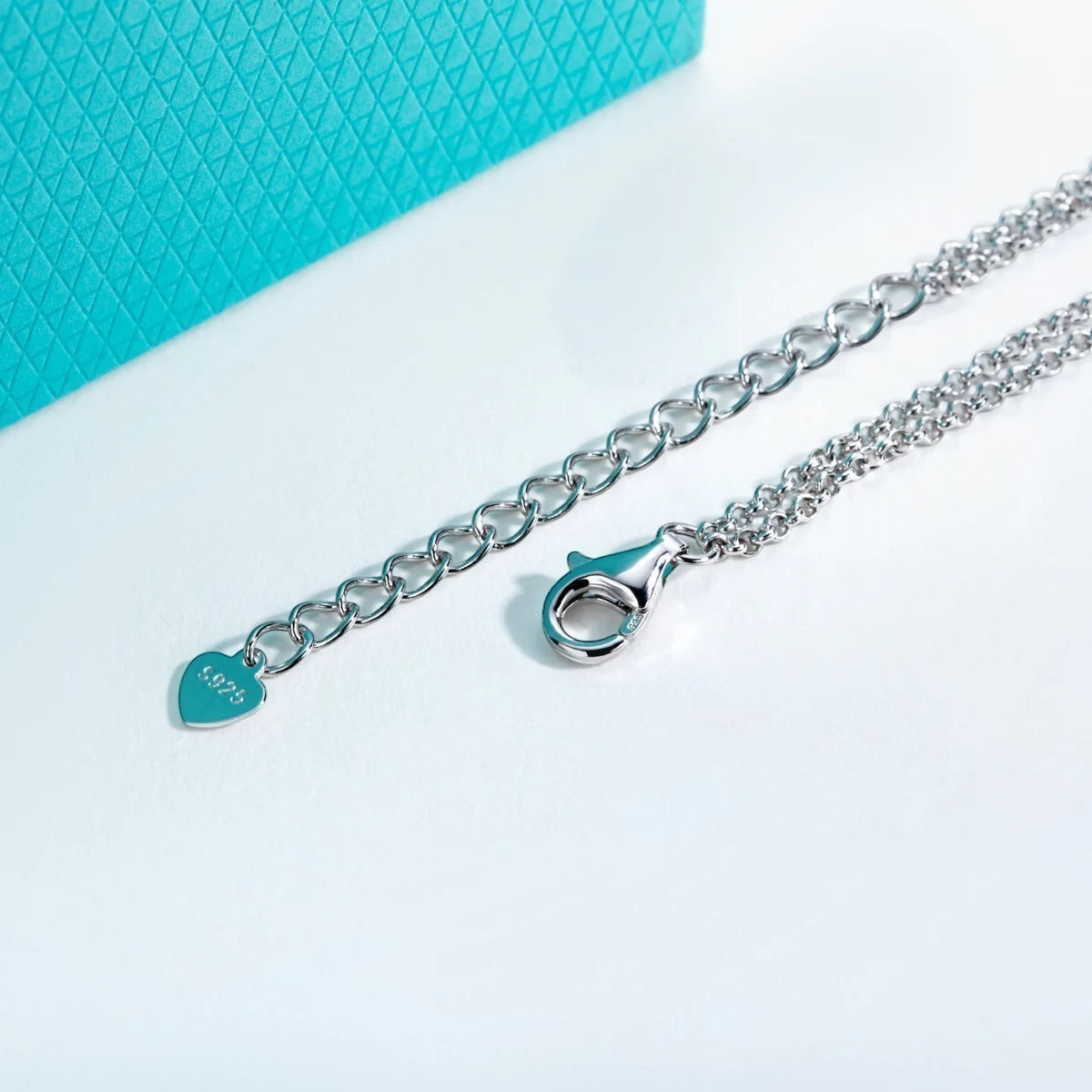 Bee-Bees s925 Sterling Silver bracelet with 18k gold plating, featuring a bow-knot design and adjustable chain with heart charm.