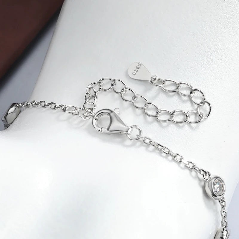 Bee-Bees 3mm moissanite bubble bracelet with pear cut accents on adjustable 925 silver chain.