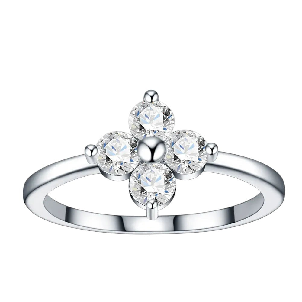 Bee-Bees sterling silver ring featuring a D-color moissanite four-leaf clover design with round-cut stones.