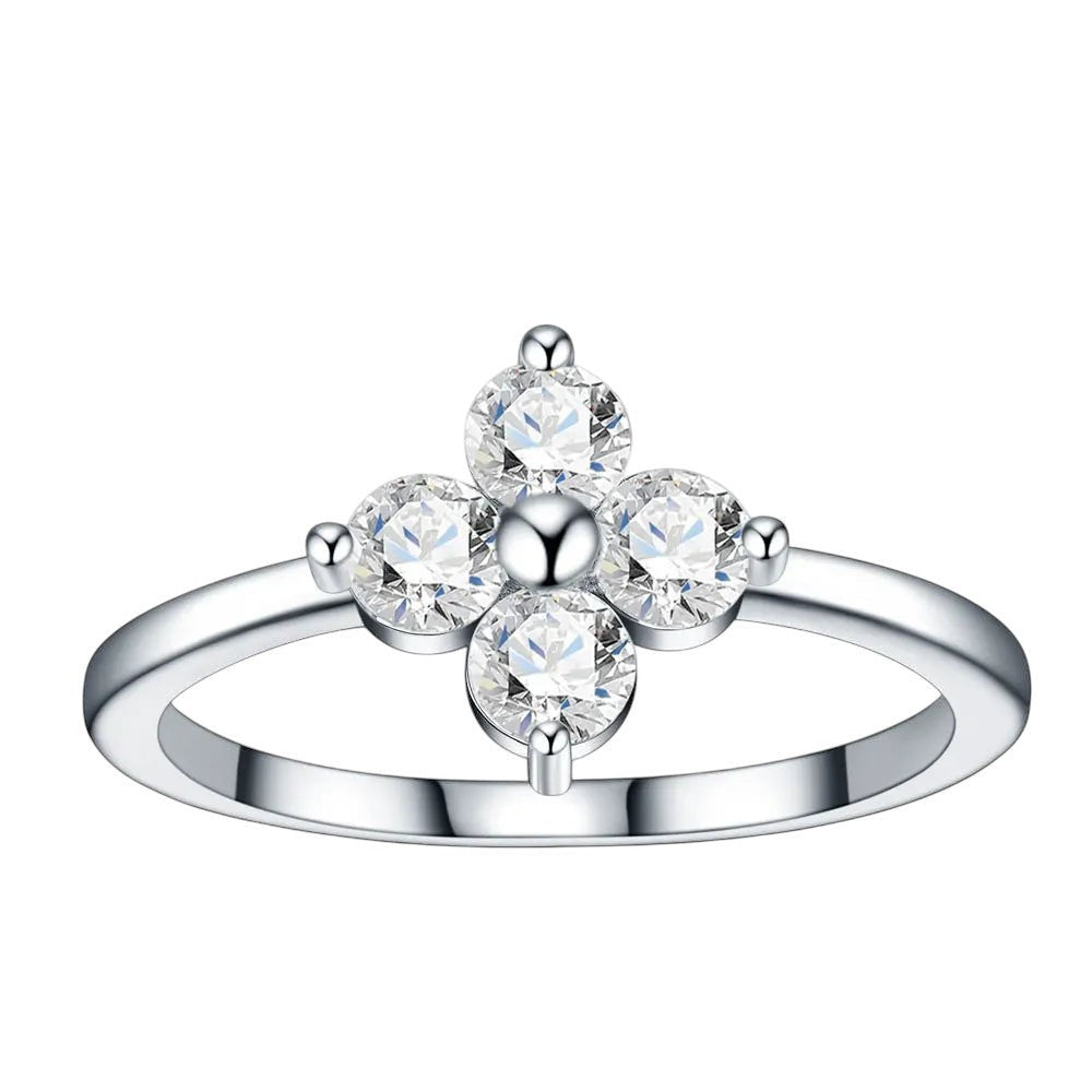 Bee-Bees sterling silver ring featuring a D-color moissanite four-leaf clover design with round-cut stones.