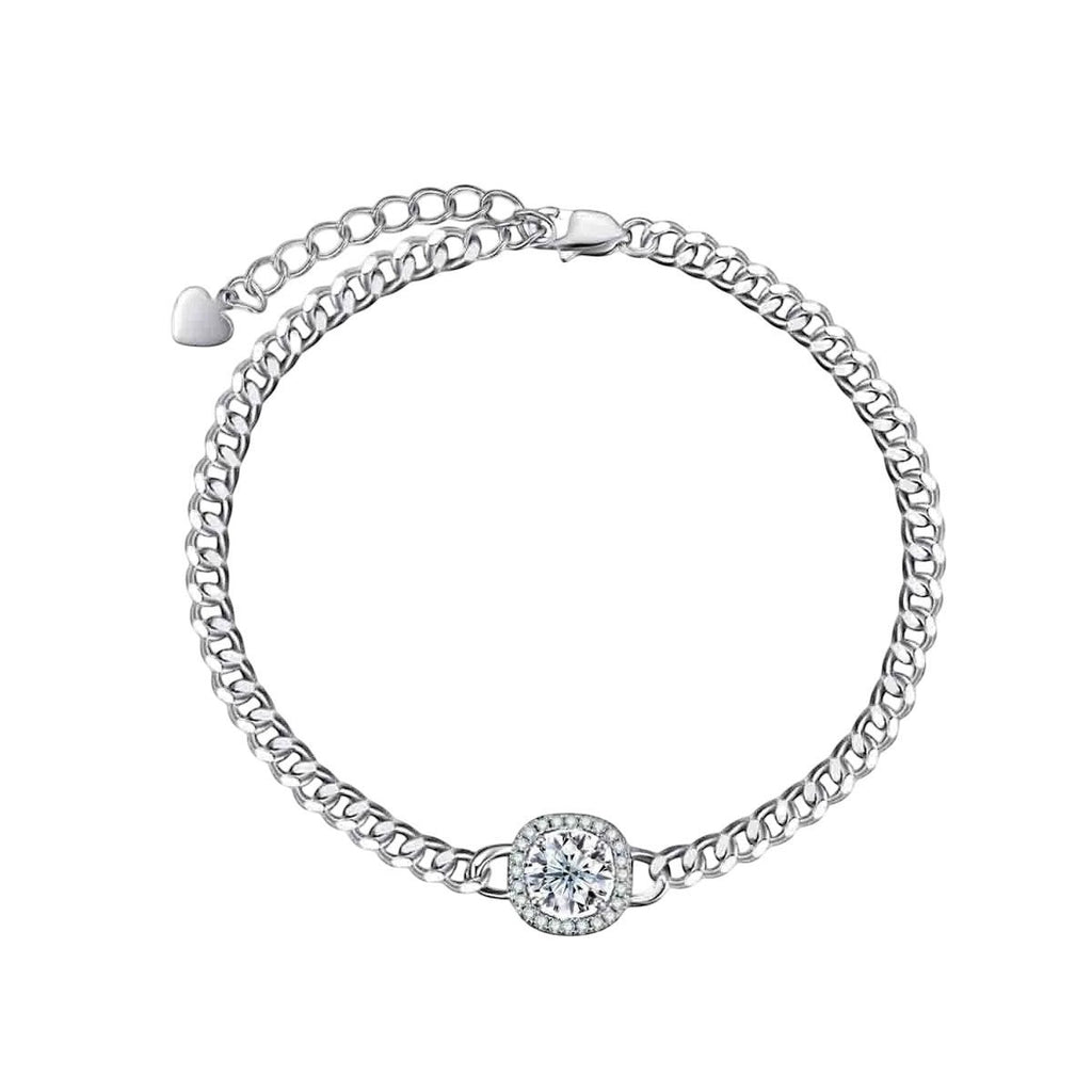 Bee-Bees Moissanite Cuban bracelet in s925 sterling silver with 18k white gold plating. Features a central round brilliant cut Moissanite stone surrounded by smaller stones in a square halo.