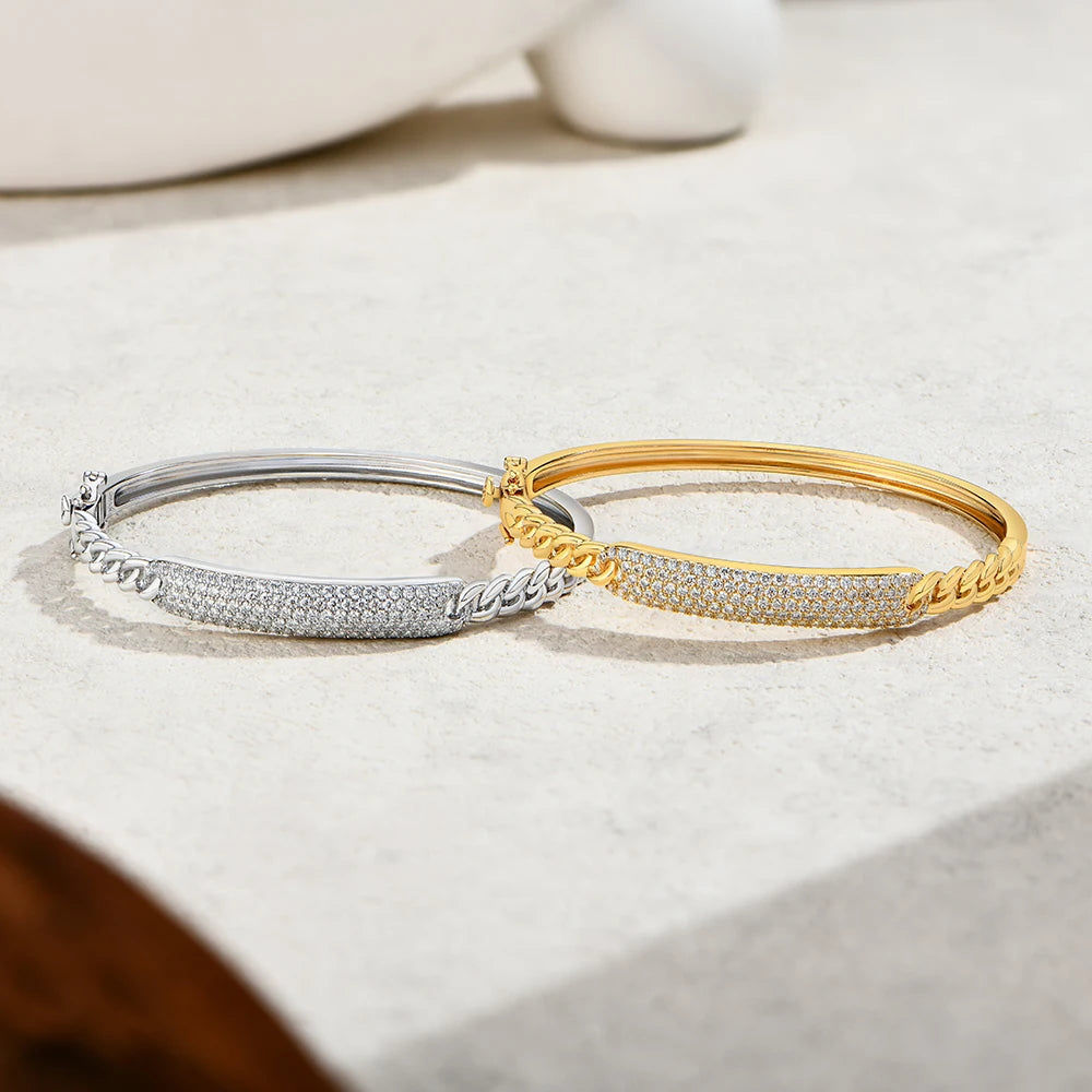 Bee-Bees moissanite Cuban link bangles in silver and gold plated sterling silver with pavé diamond-like stones.