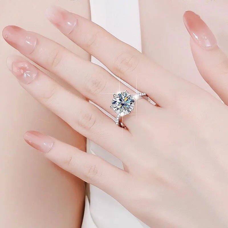 Bee-Bees 5ct Moissanite diamond ring with 18K white gold plating on S925 sterling silver band. GRA certified.