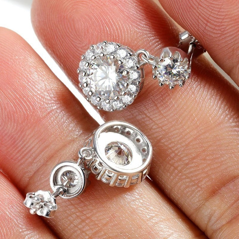 Bee-Bees 1ct round cut moissanite drop earrings in S925 silver with halo setting and GRA certification.