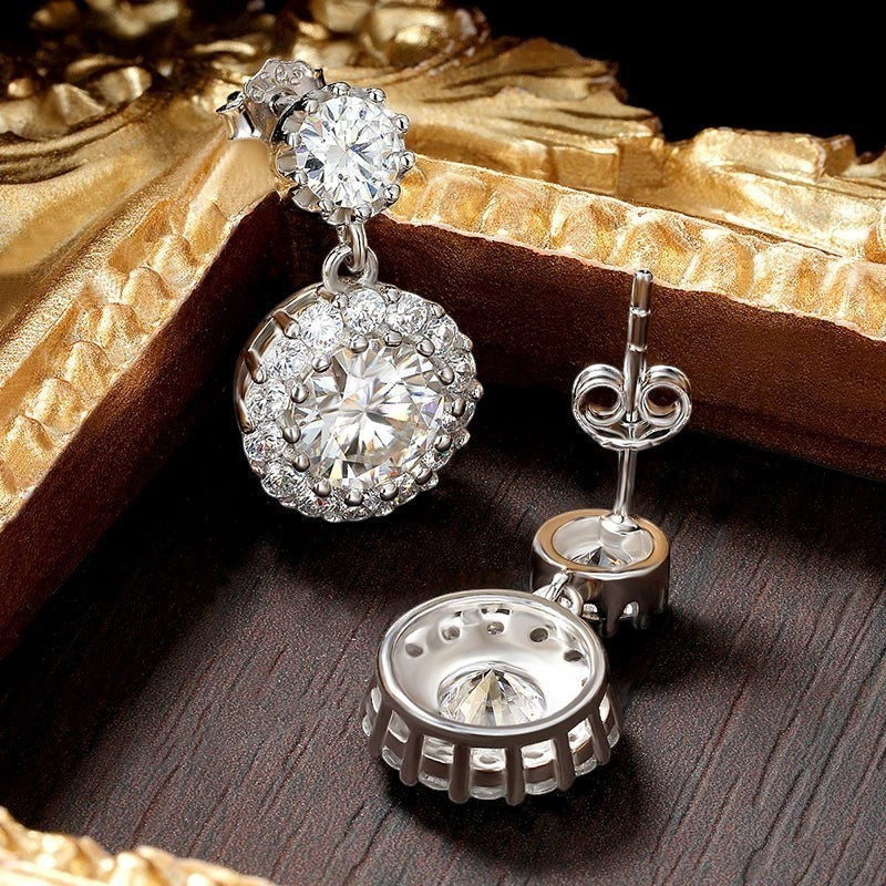 Bee-Bees 1ct round cut moissanite drop earrings in S925 silver with halo setting. GRA certified.