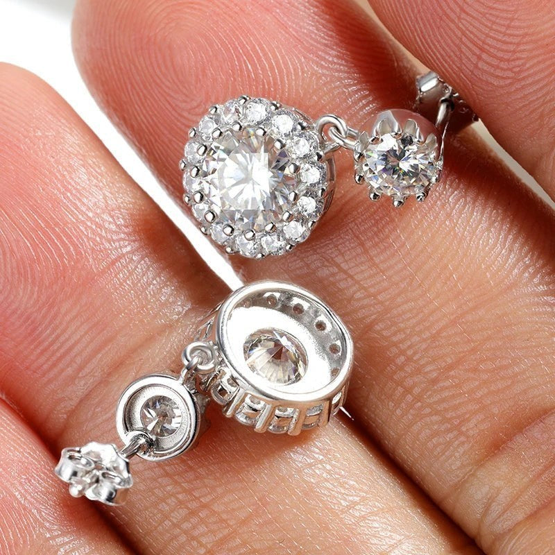 Bee-Bees 1ct round cut moissanite drop earrings in S925 silver with halo setting and GRA certification.