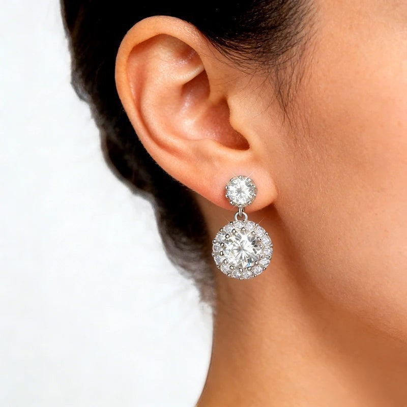 Bee-Bee's white gold plated sterling silver drop earrings with round cut moissanite stones, 1ct equivalent each.