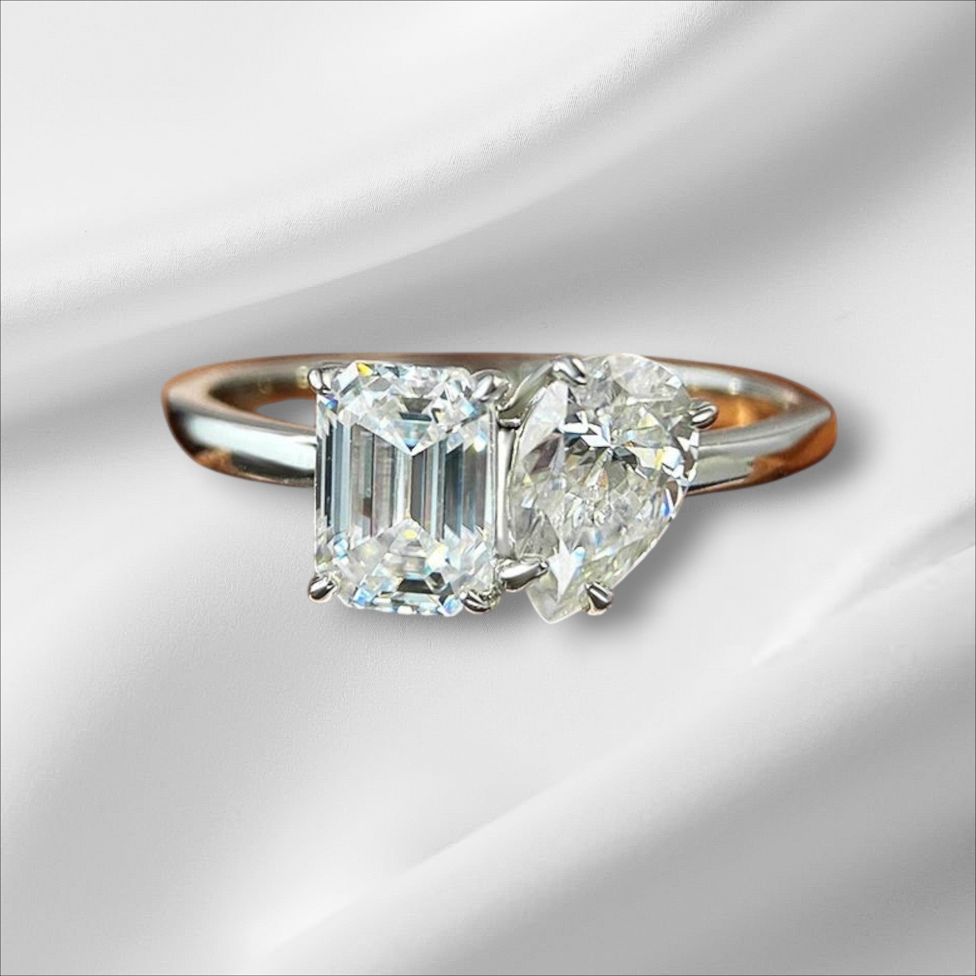 Bee-Bees 1ct or 2ct D VVS1 Moissanite engagement ring in S925 silver with 18K white gold plating, featuring emerald and pear cut stones.