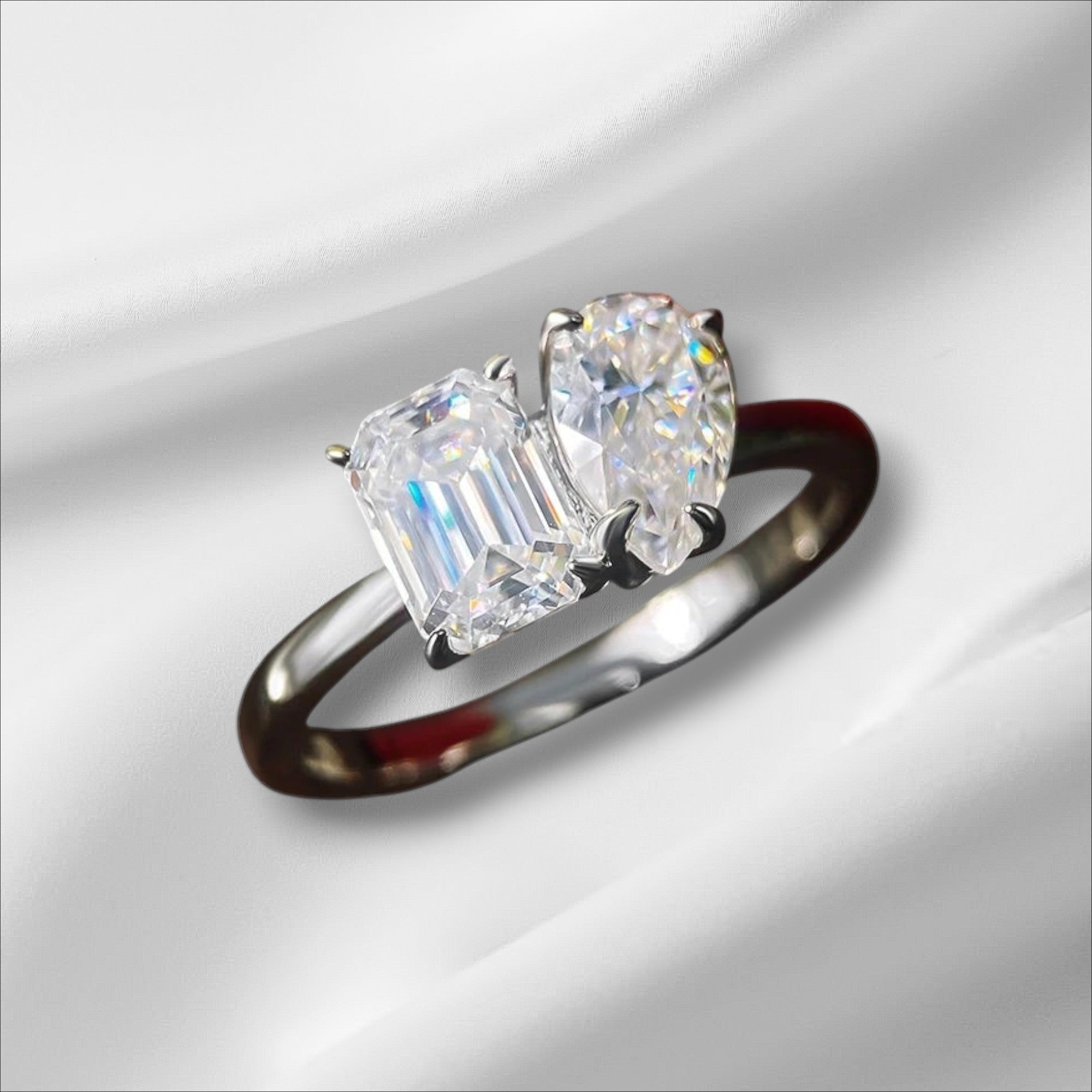 Bee-Bees engagement ring with emerald-cut and pear-cut D VVS1 moissanite stones in S925 silver with 18K white gold plating.