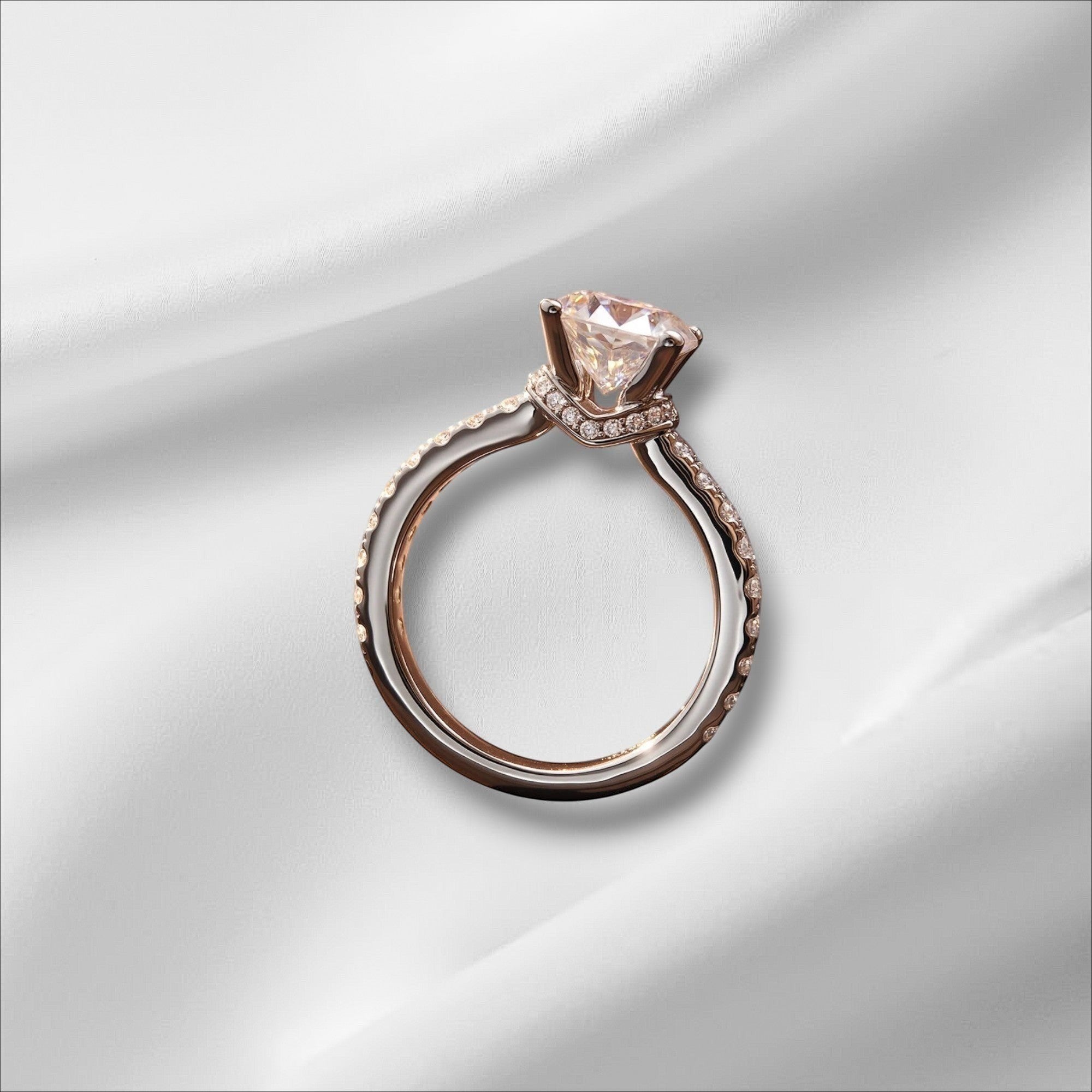 Bee-Bees 1.5ct Moissanite engagement ring in rose gold plated sterling silver with a round brilliant cut center stone and pavé band.