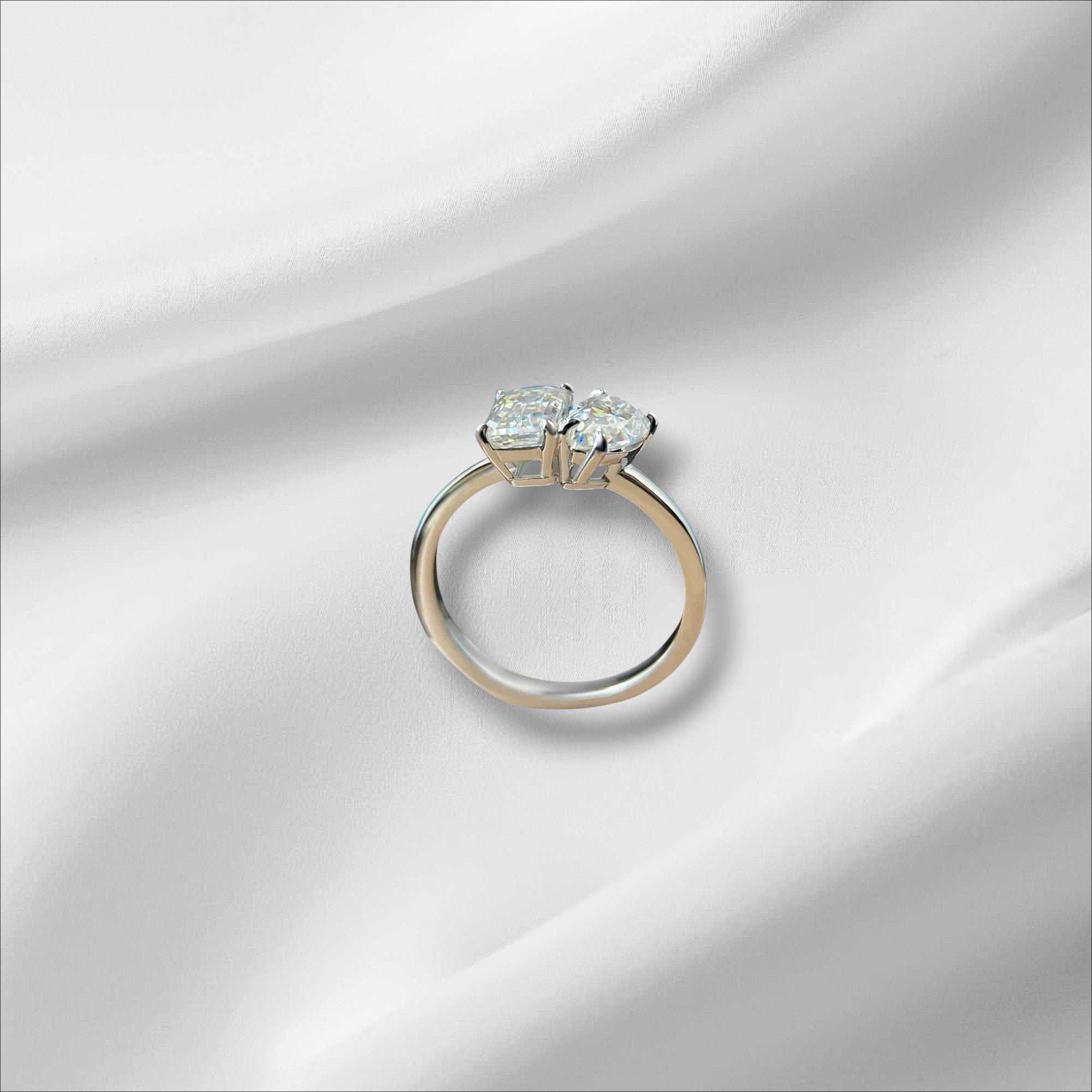 Bee-Bees 1ct/2ct D VVS1 Moissanite engagement ring in S925 silver with 18K white gold plating, featuring two stones in a classic 4-prong setting.