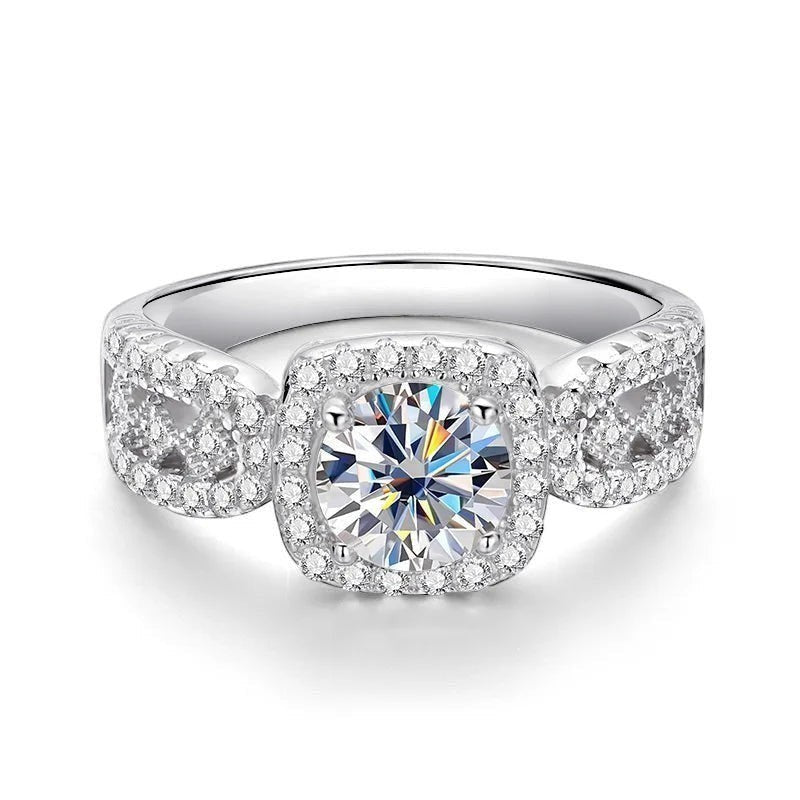Bee-Bees 1ct D VVS1 Moissanite engagement ring in 18k white gold plated 925 silver with halo and side stones.