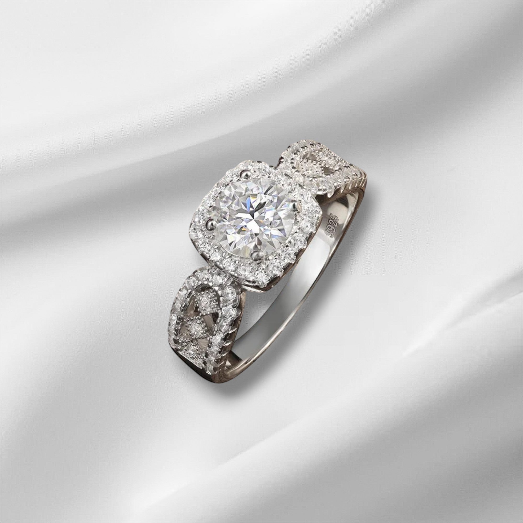 Bee-Bees 1ct D VVS1 Moissanite engagement ring in 18k white gold plated 925 silver with halo and intricate band.